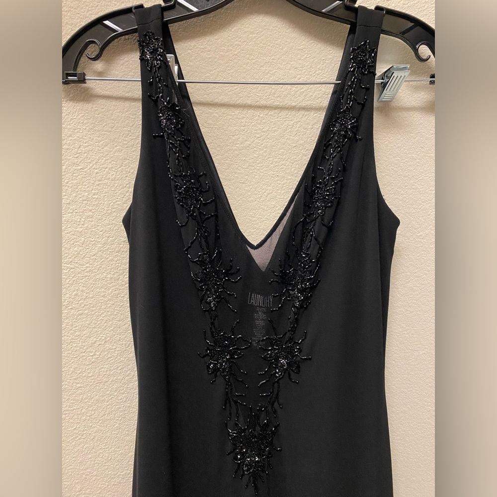 Laundry mid length black dress with neck line beading.